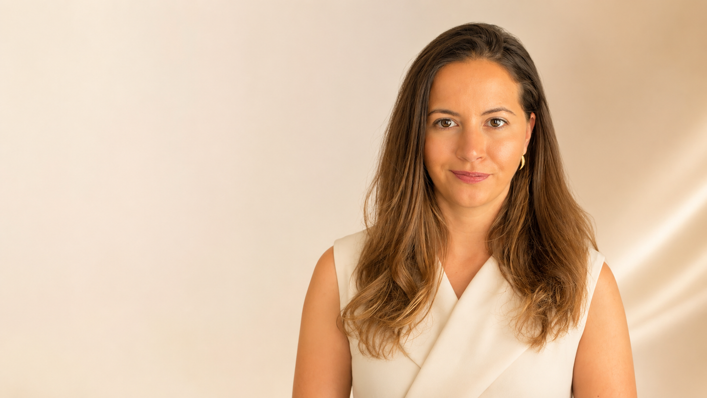 Larisa Beaumont, founder of British jewellery brand Larisa Beaumont, wearing solid 14k gold earrings